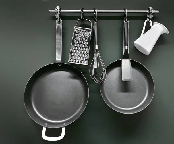 Cooking utensils hanging on a pot rack
